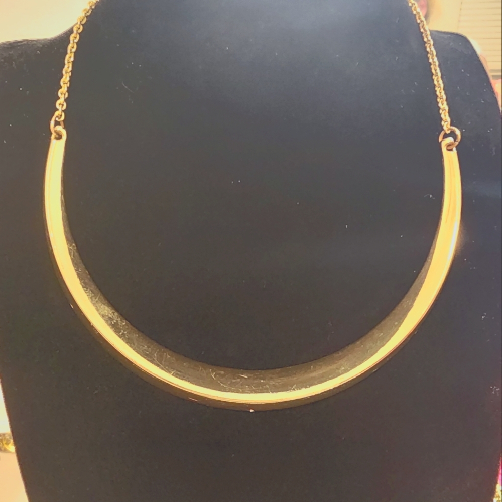Goldtone hard chocker style necklace. High polished